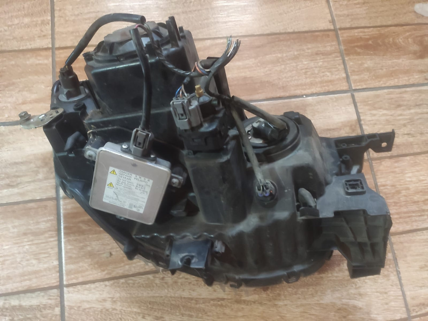 Farol Dianteiro Esquerdo Pajero dakar L200 Xenon 09-16 origi